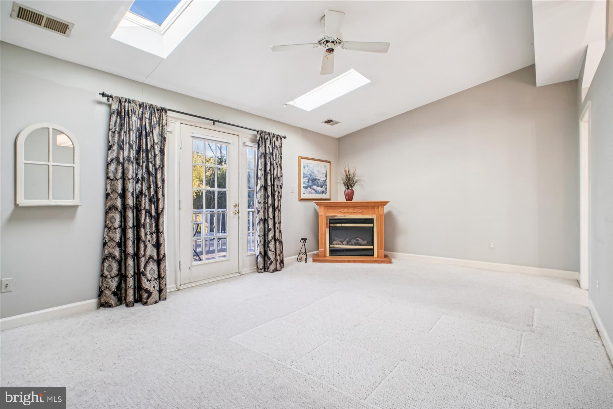 2627 Five Oaks Road Vienna, VA 22181 - Photo 53 of 111 a view of an empty room with a fireplace and a window