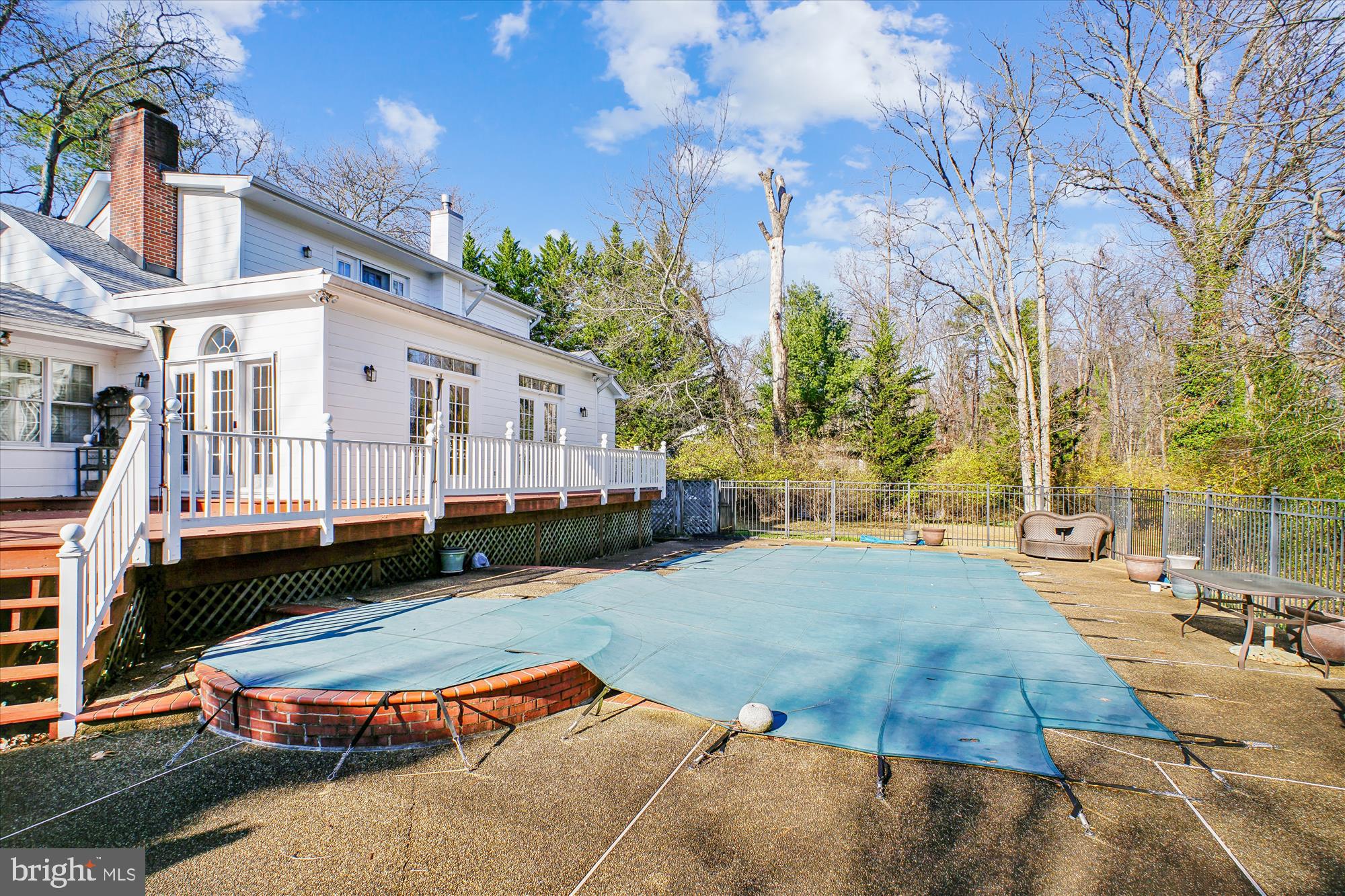 2627 Five Oaks Road Vienna, VA 22181 - Photo 68 of 111 a backyard of a house with barbeque oven table and chairs