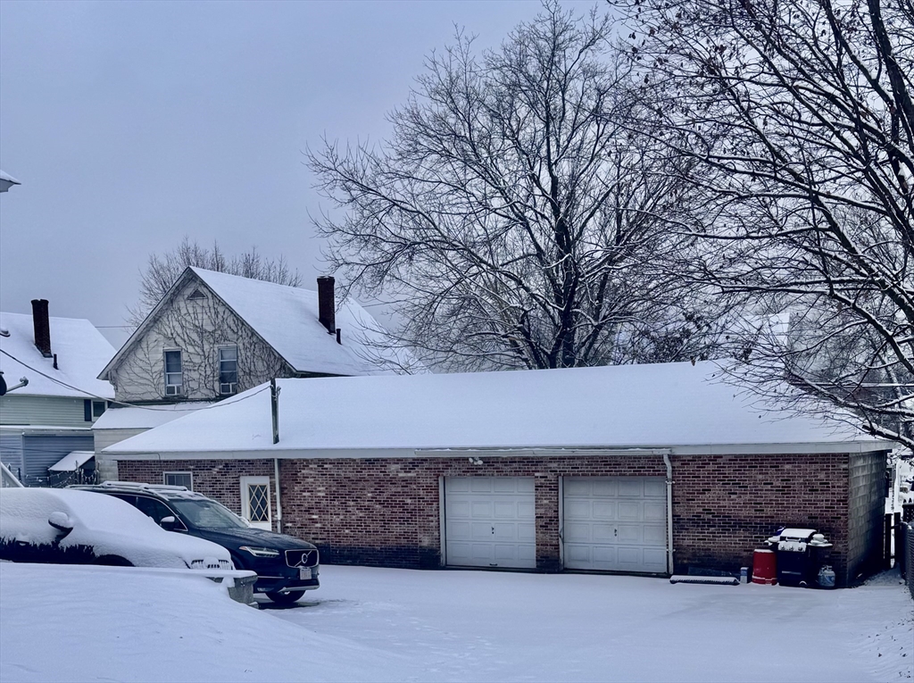18-22 Burgess Street Lowell, MA 01851 - Photo 3 of 12 a view of a car park in front of house