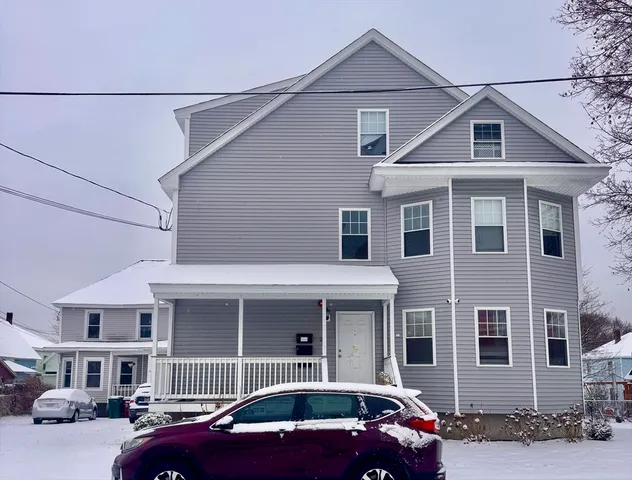 a front view of a house with parking