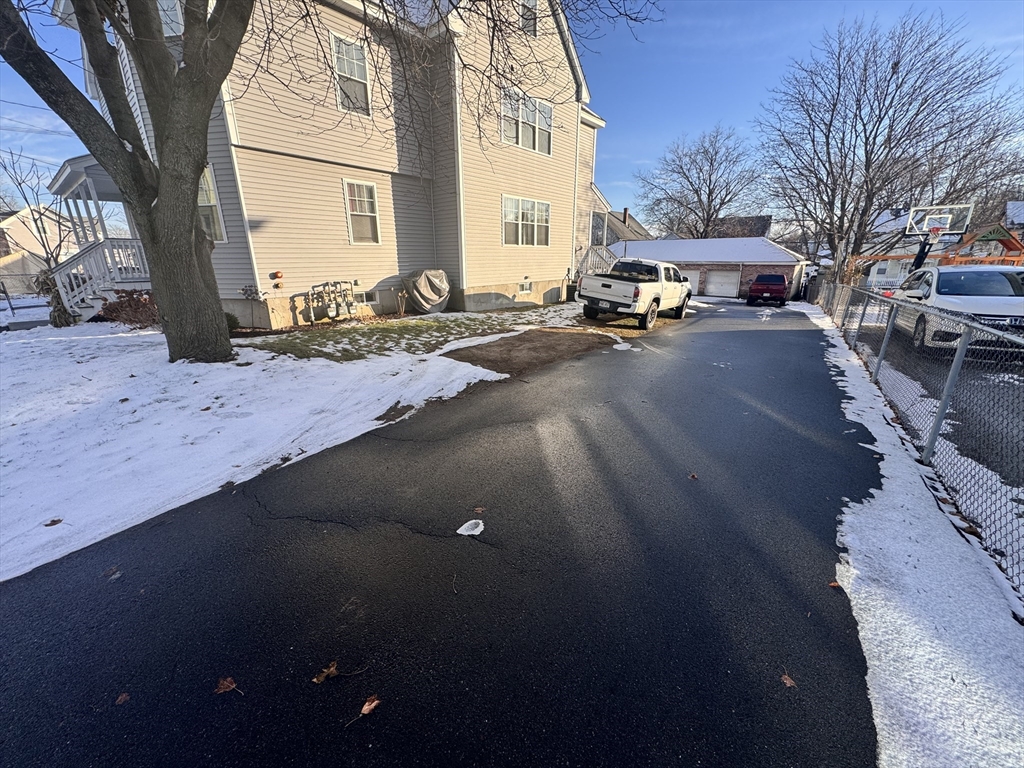 18-22 Burgess Street Lowell, MA 01851 - Photo 6 of 12 a cars parked on the side of street