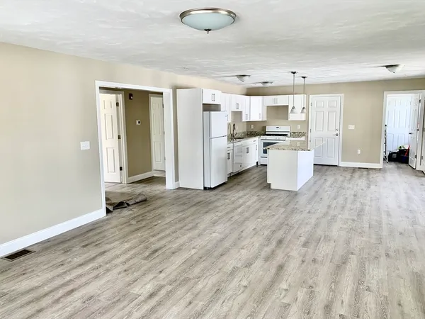 a view of a kitchen with appliances and cabinets