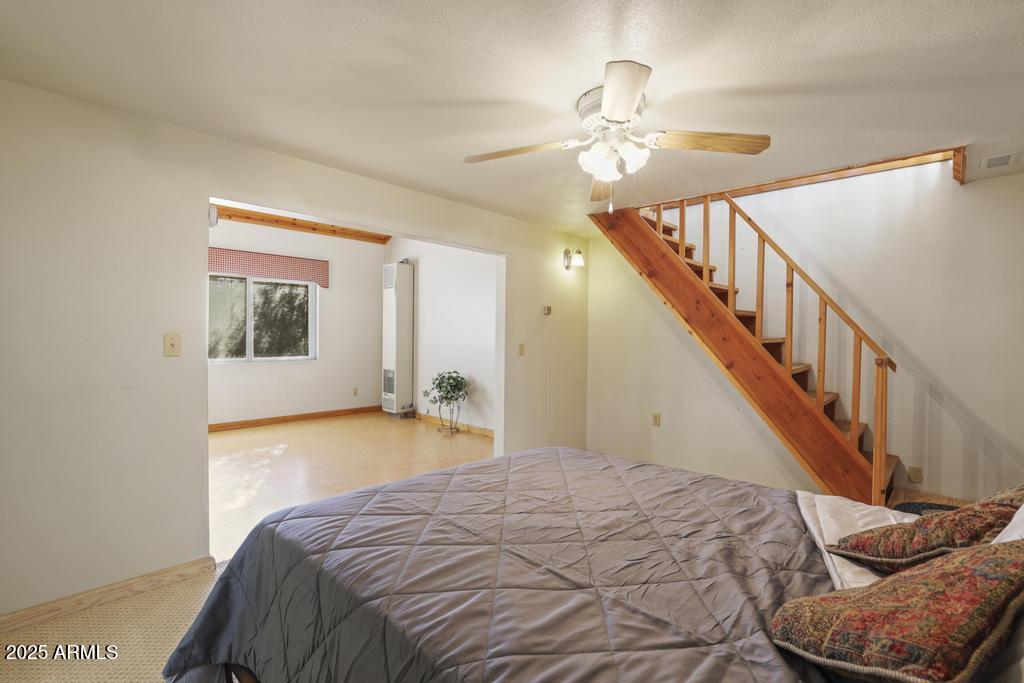 7984 Vista Del Norte Payson, AZ 85541 - Photo 12 of 21 a bedroom with a bed and a chandelier