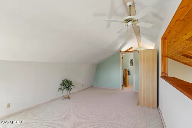 a bathroom with a sink and mirror with toilet