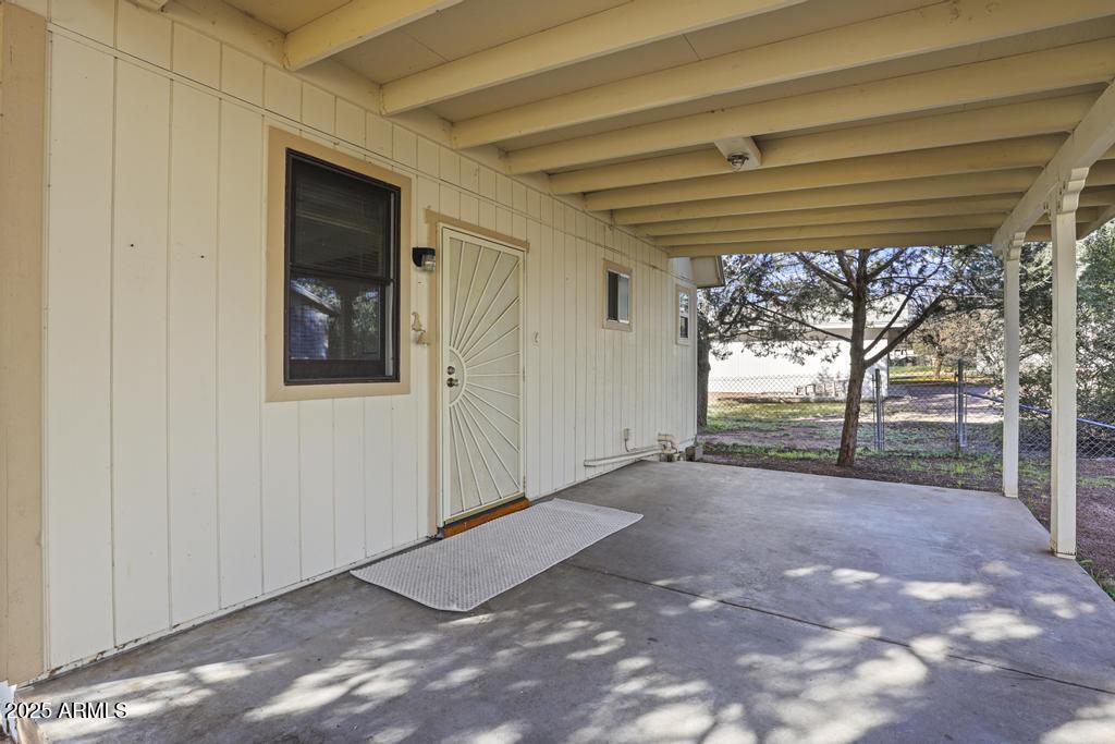 7984 Vista Del Norte Payson, AZ 85541 - Photo 5 of 21 a view of a room with a large window and wooden door