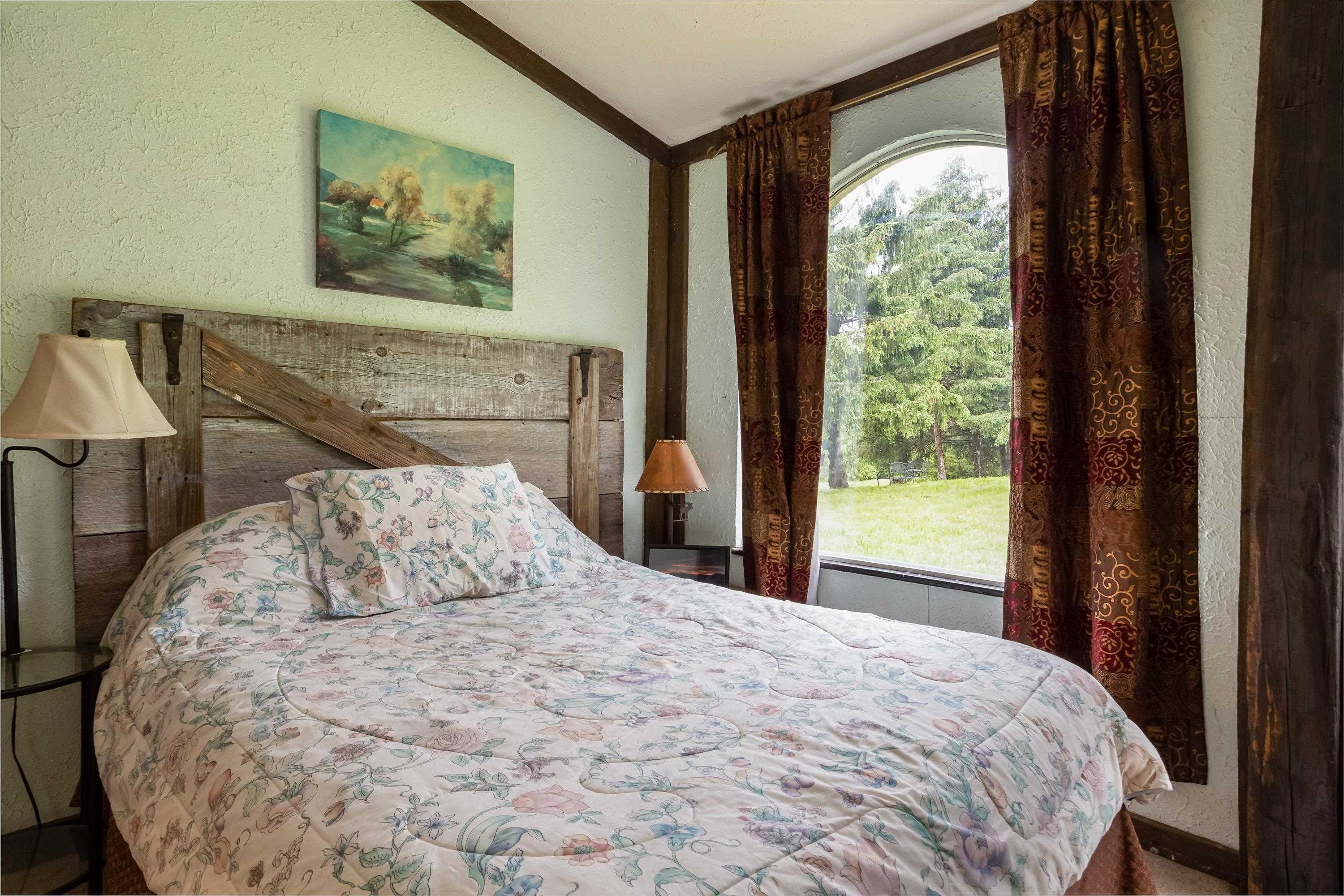9881 Fort Valley Road Fort Valley, VA 22652 - Photo 20 of 75 a bedroom with a bed and a painting on the wall