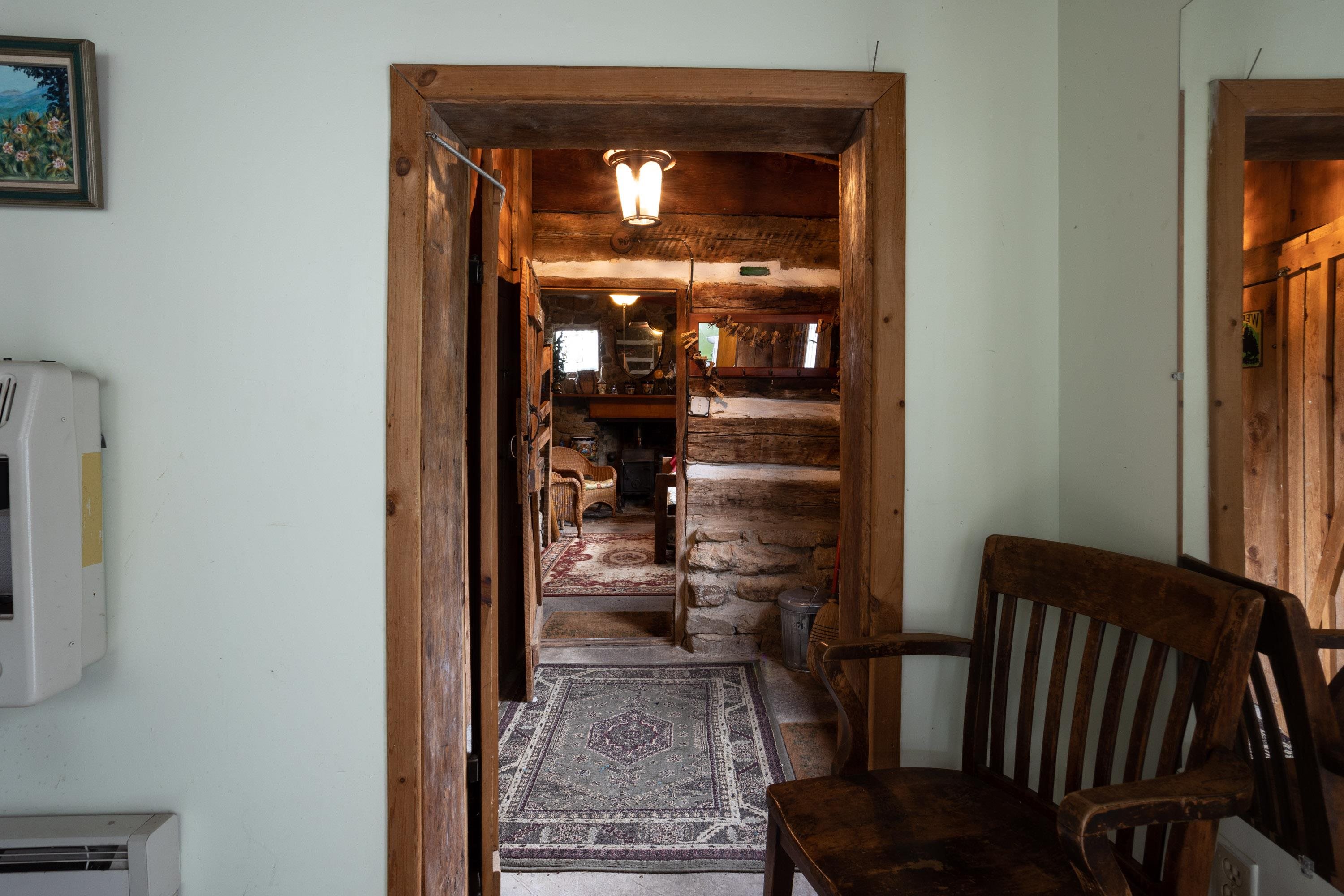 9881 Fort Valley Road Fort Valley, VA 22652 - Photo 28 of 75 a view of a hallway with wooden floor and windows