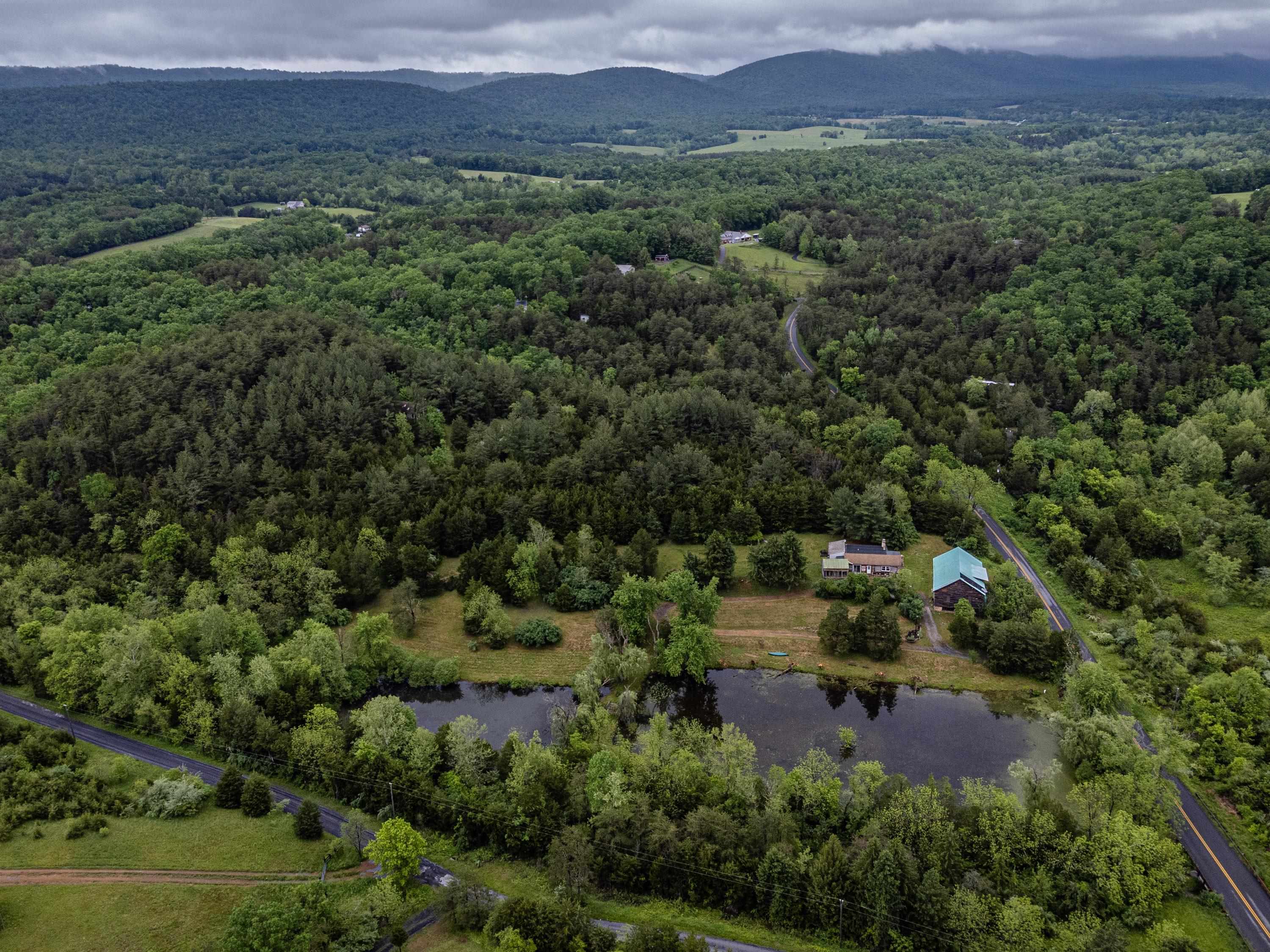 9881 Fort Valley Road Fort Valley, VA 22652 - Photo 53 of 75 an aerial view of green landscape with trees houses and mountain view