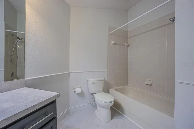 a bathroom with a sink vanity and a mirror