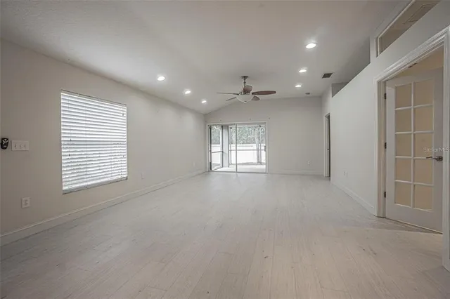 a view of an empty room with a window