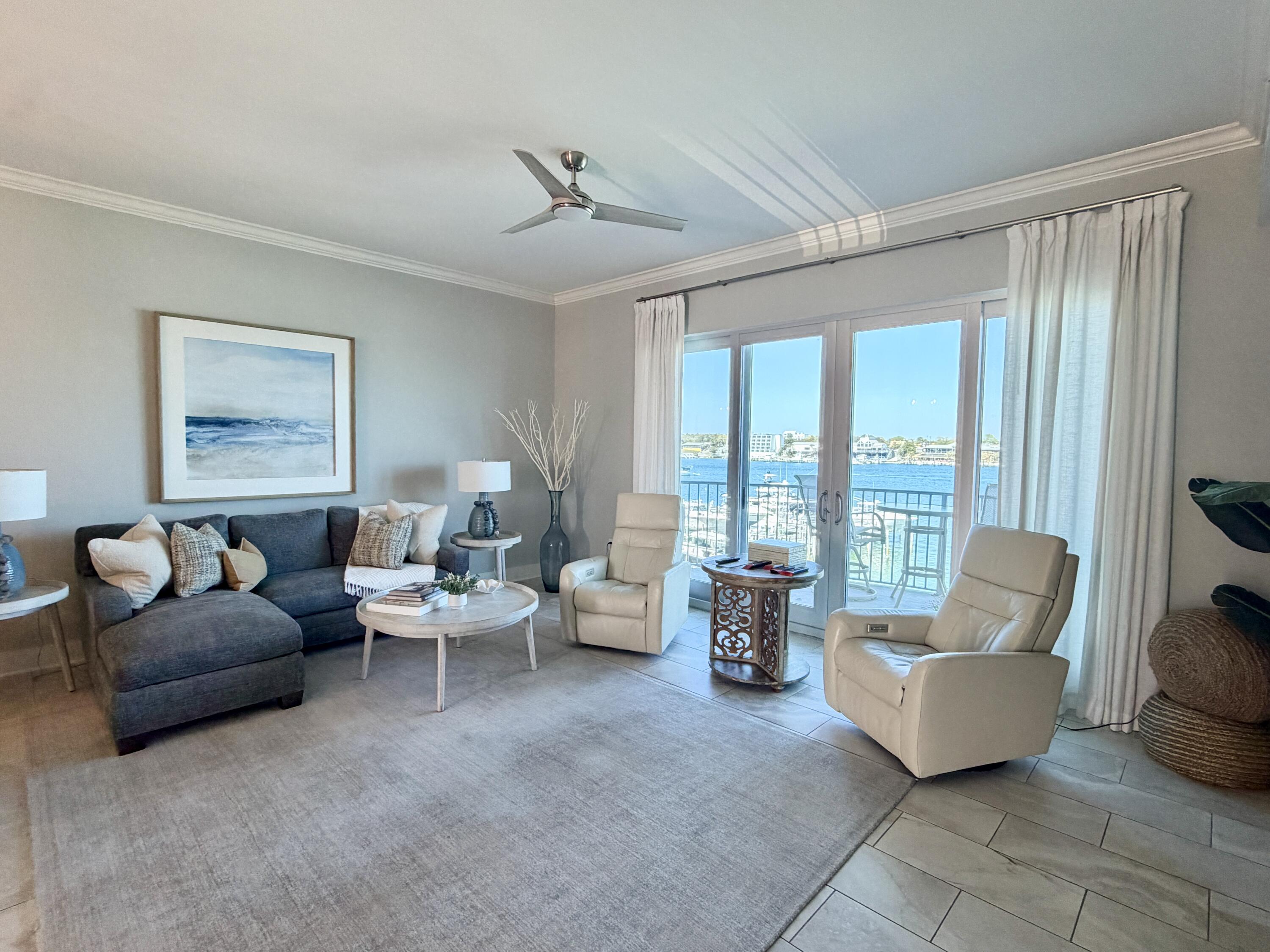 211 Durango Road, Unit 315 Destin, FL 32541 - Photo 2 of 2 a living room with furniture and large windows