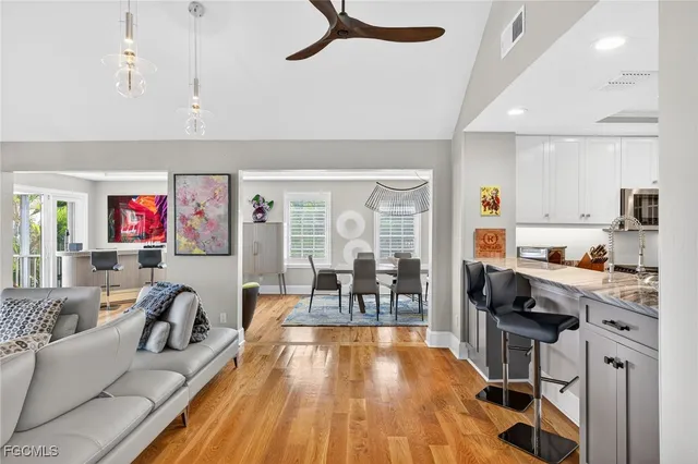 a living room with fireplace furniture and a wooden floor