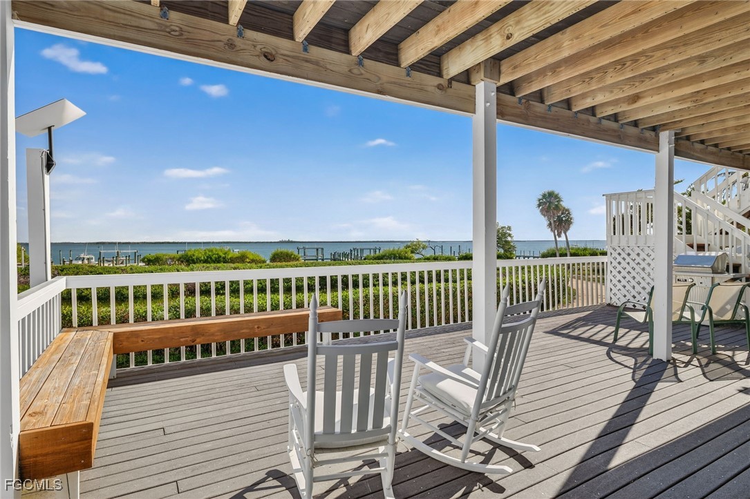 323 Useppa Island Bokeelia, FL 33922 - Photo 16 of 36 a view of a balcony with furniture