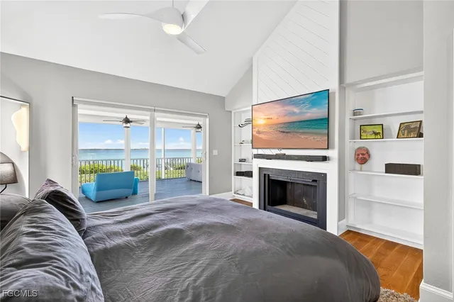 a bedroom with a bed and a fireplace