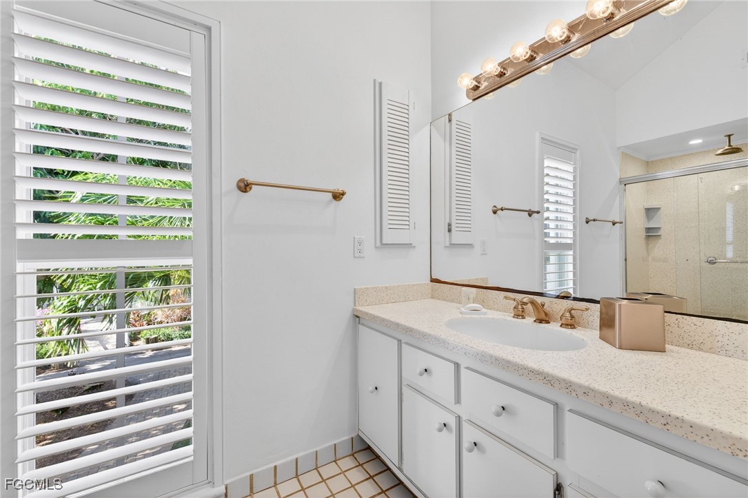 323 Useppa Island Bokeelia, FL 33922 - Photo 19 of 36 a bathroom with a sink and a mirror
