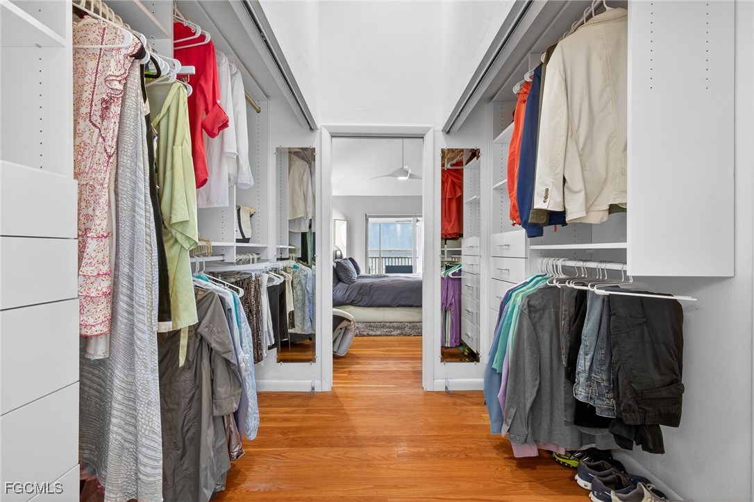 323 Useppa Island Bokeelia, FL 33922 - Photo 20 of 36 a view of walk in closet with clothes and shoes
