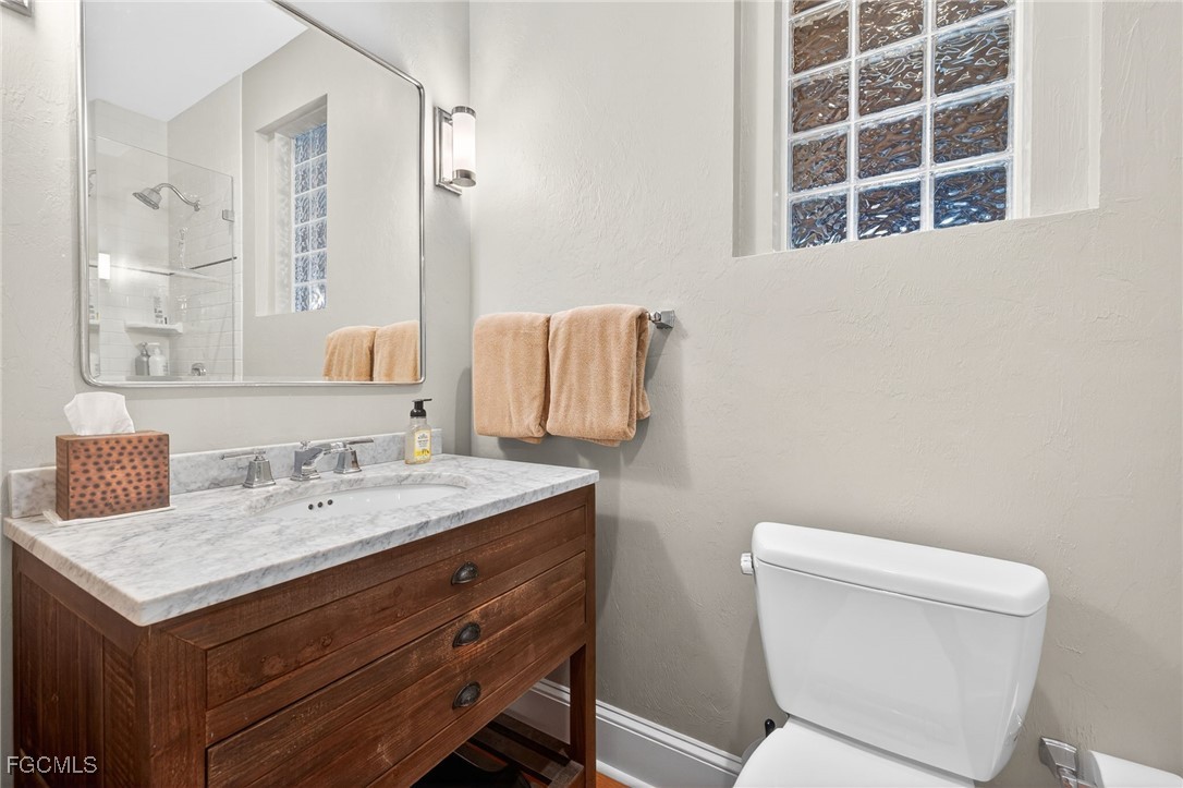 323 Useppa Island Bokeelia, FL 33922 - Photo 24 of 36 a bathroom with a sink and a mirror