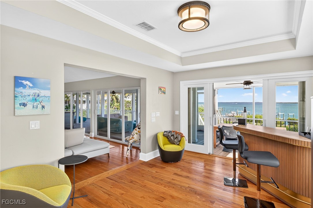 323 Useppa Island Bokeelia, FL 33922 - Photo 28 of 36 a living room with furniture a window and a table