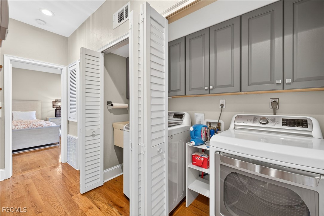 323 Useppa Island Bokeelia, FL 33922 - Photo 30 of 36 a utility room with dryer and washer