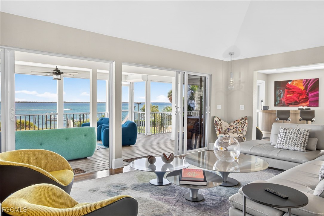 323 Useppa Island Bokeelia, FL 33922 - Photo 8 of 36 a living room with furniture and a large window