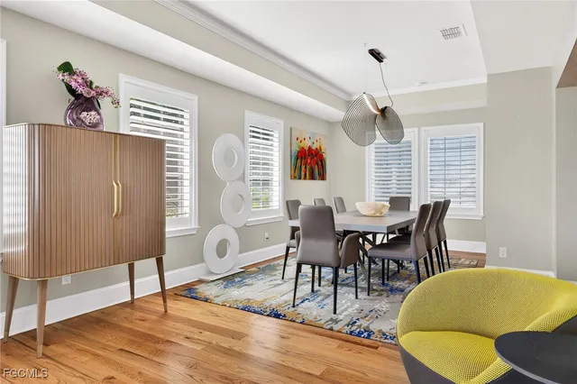 a view of a dining room with furniture and wooden floor