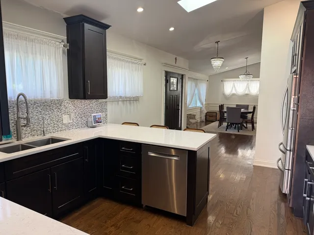 a kitchen with a sink and cabinets