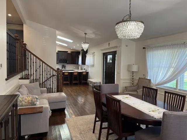 a view of a livingroom with furniture window and wooden floor