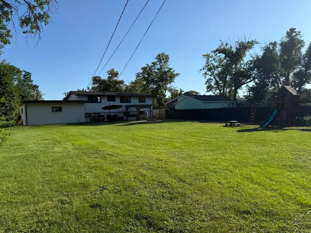 a view of a lake with a house in the background