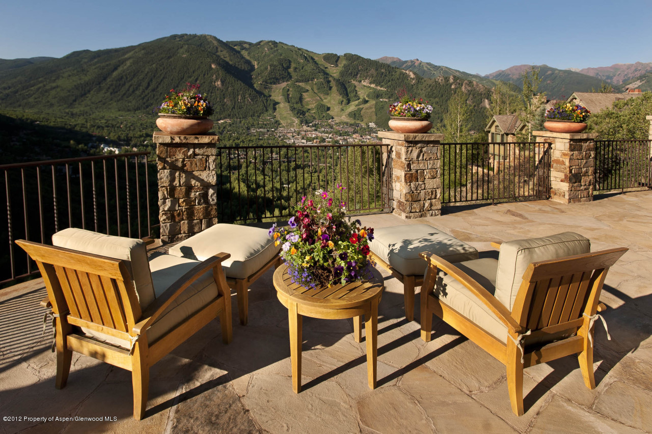 a view of a chairs and table in the terrace