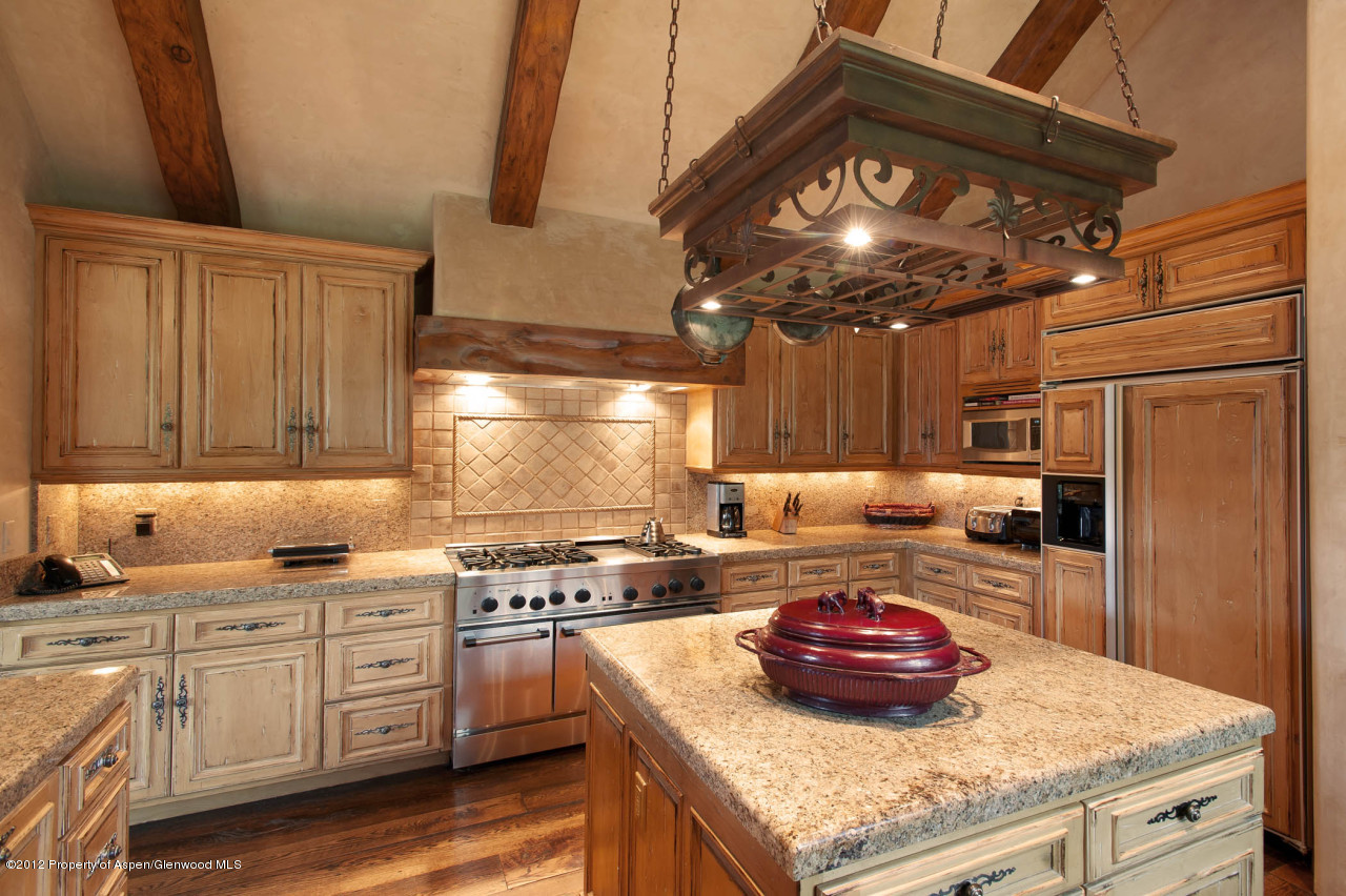 639 Hunter Creek Road Aspen, CO 81611 - Photo 3 of 13 a kitchen with stainless steel appliances granite countertop a stove a sink dishwasher and cabinets with wooden floor
