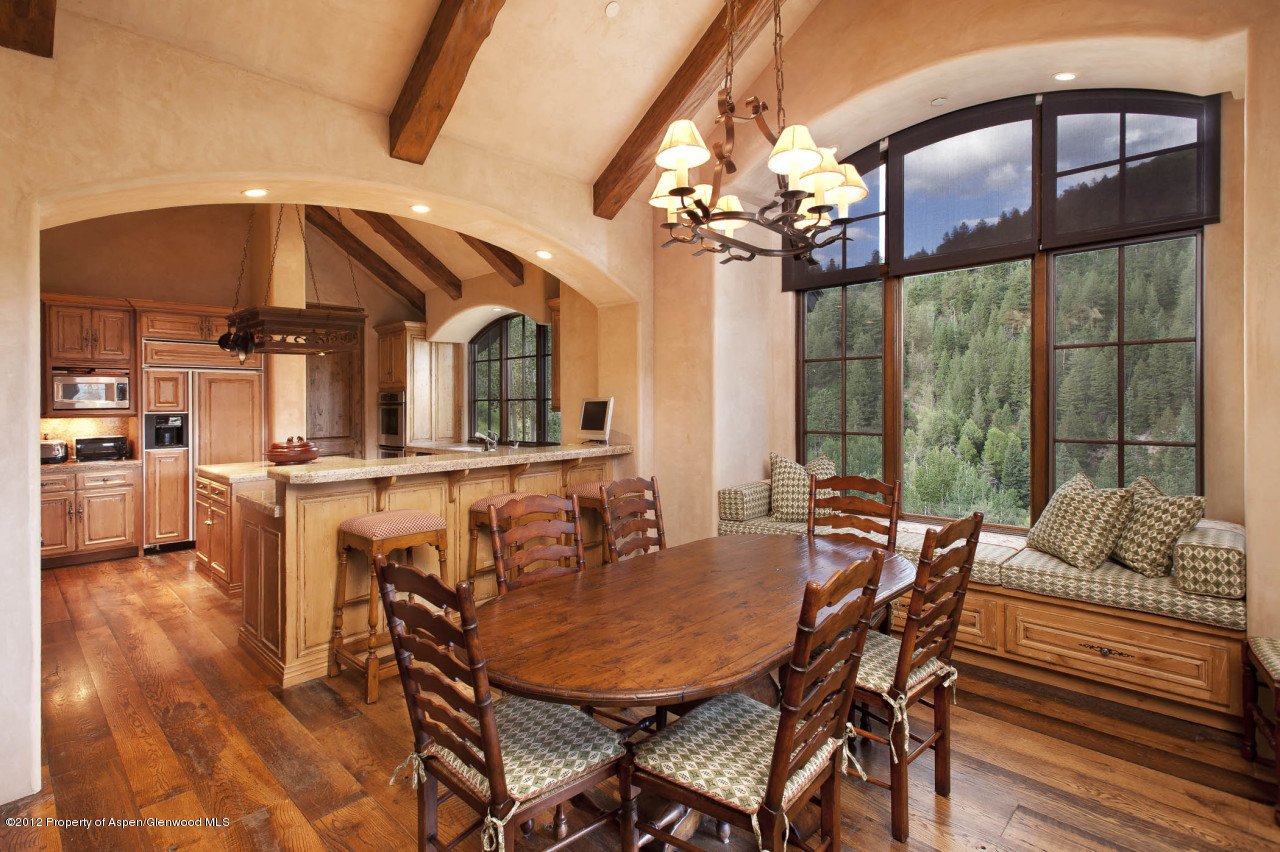639 Hunter Creek Road Aspen, CO 81611 - Photo 4 of 13 a view of a dining room with furniture window and wooden floor