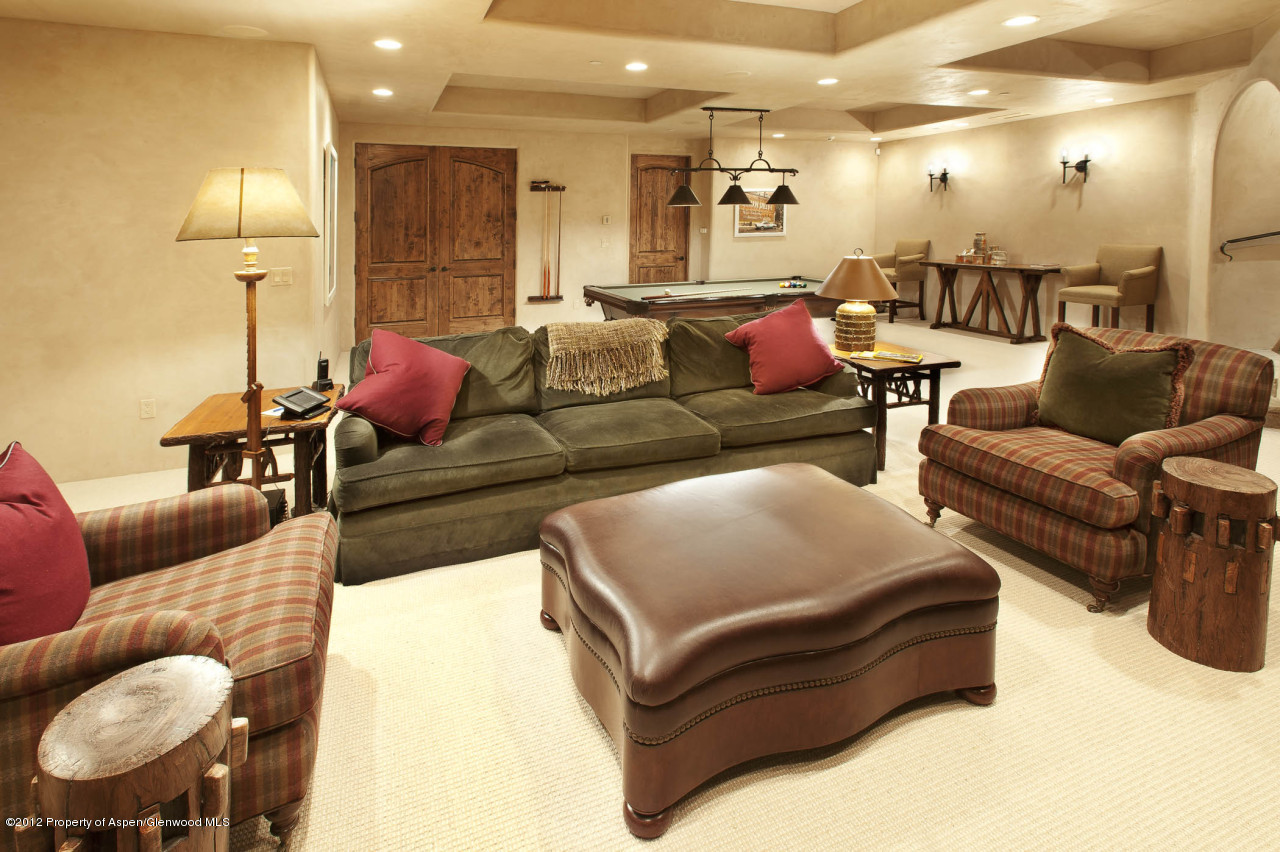 639 Hunter Creek Road Aspen, CO 81611 - Photo 7 of 13 a living room with furniture and a lamp