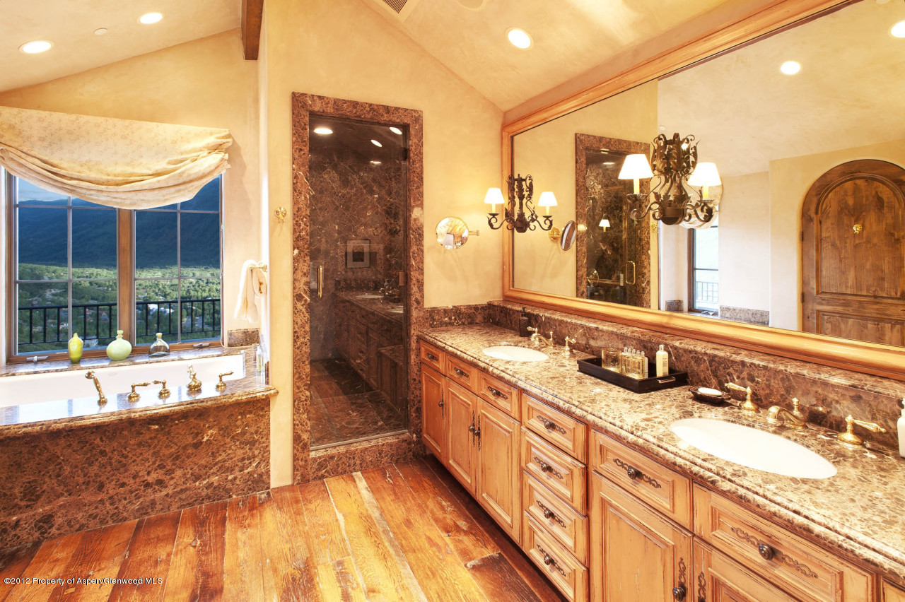 639 Hunter Creek Road Aspen, CO 81611 - Photo 10 of 13 a bathroom with a tub sink and mirror