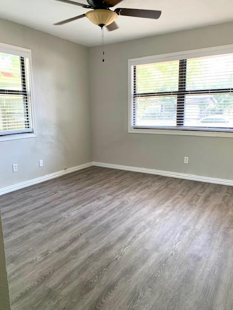 768 Pine Street Hurst, TX 76053 - Photo 6 of 11 Spare room featuring wood finished floors and a ceiling fan