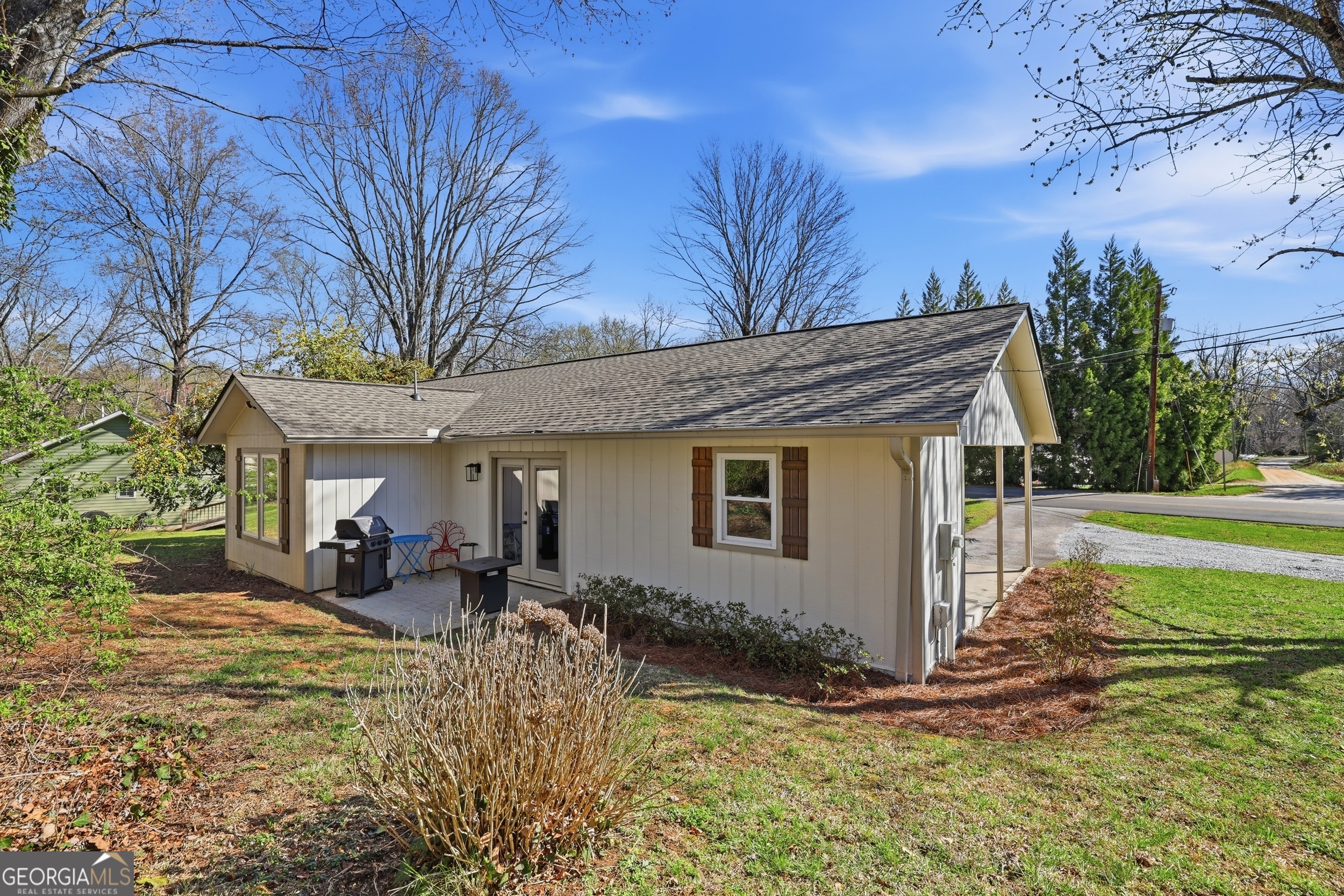 232 Stekoa Falls Road Clayton, GA 30525 - Photo 23 of 24 a view of a house with backyard and sitting area