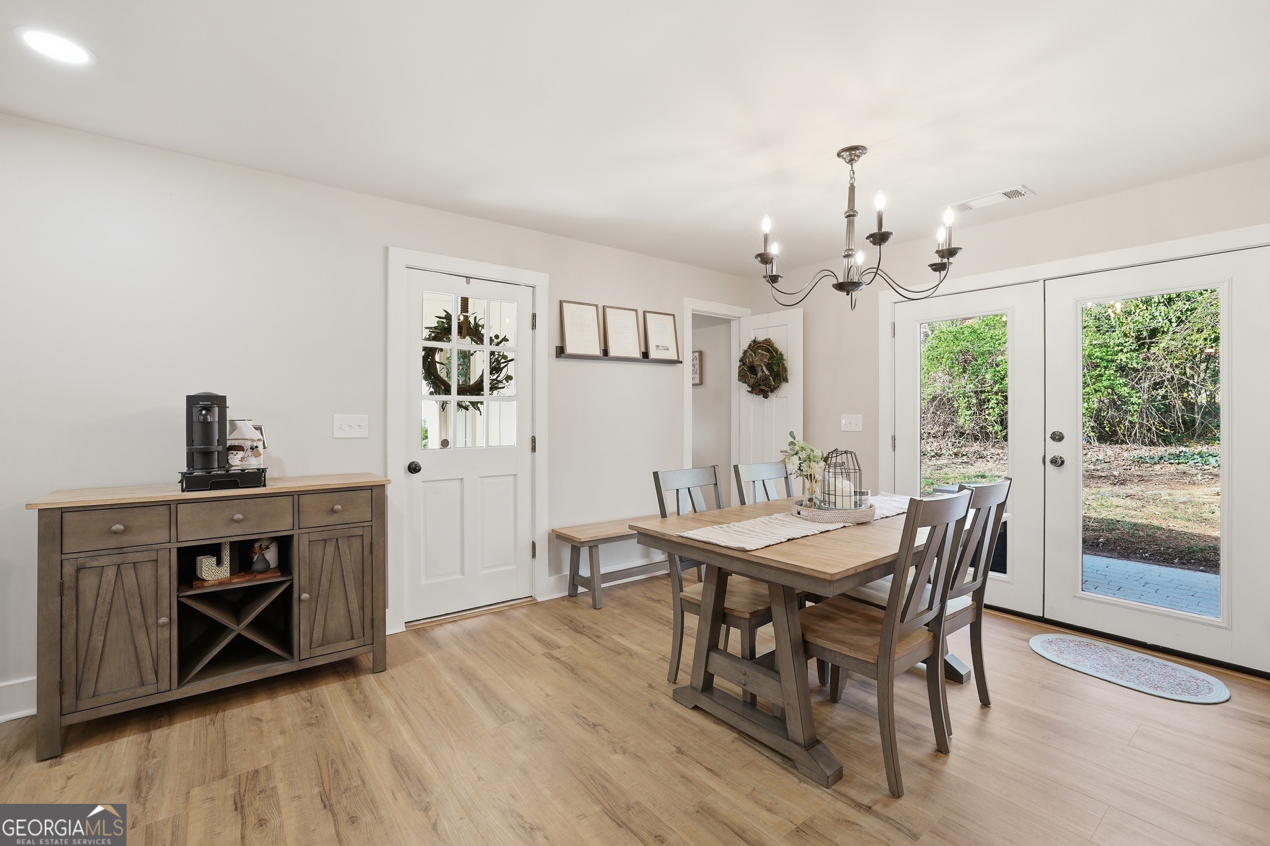 232 Stekoa Falls Road Clayton, GA 30525 - Photo 8 of 24 a view of a dining room with furniture window and wooden floor