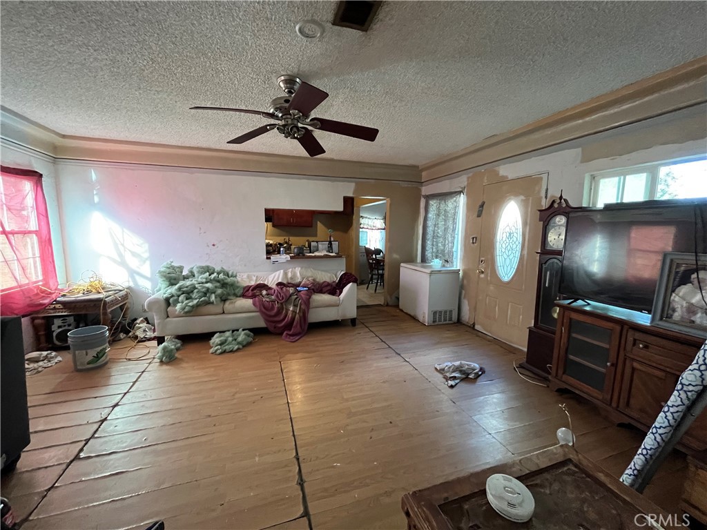 45639 King Street Indio, CA 92201 - Photo 13 of 28 a living room with furniture and a flat screen tv