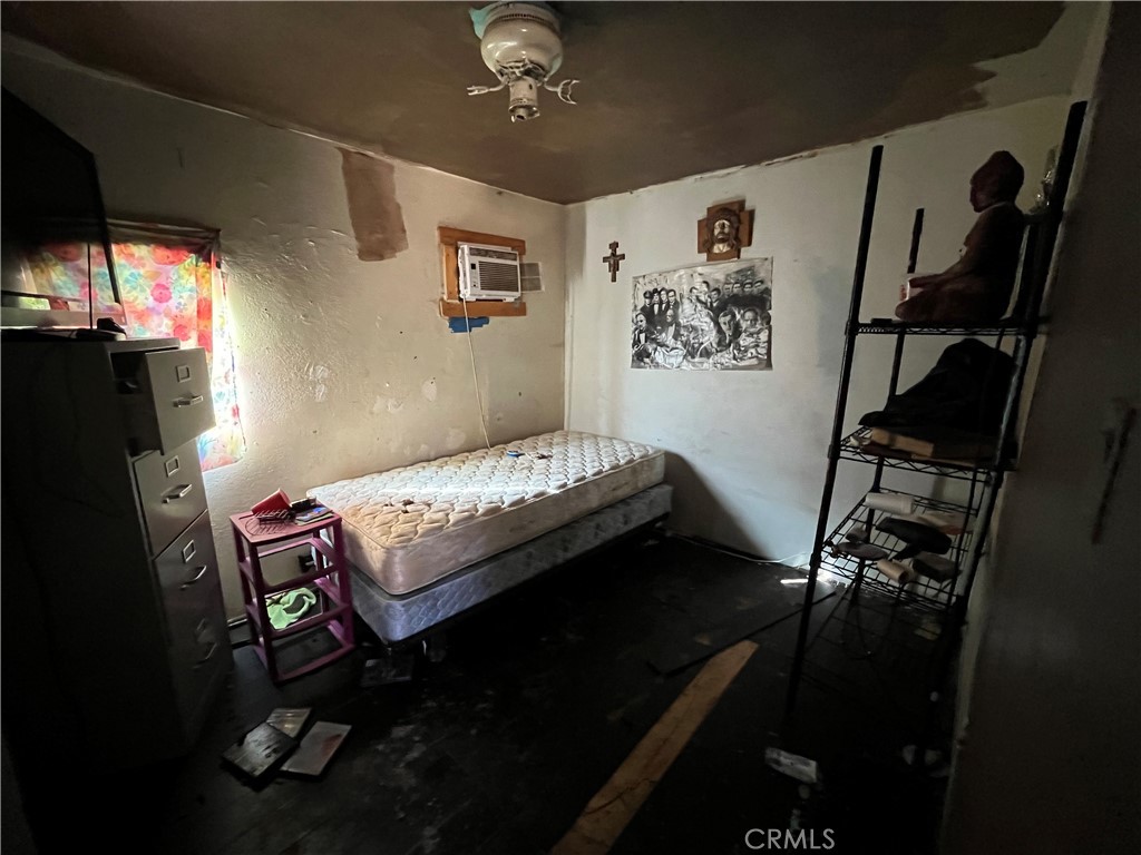 45639 King Street Indio, CA 92201 - Photo 20 of 28 a bedroom with furniture and a window