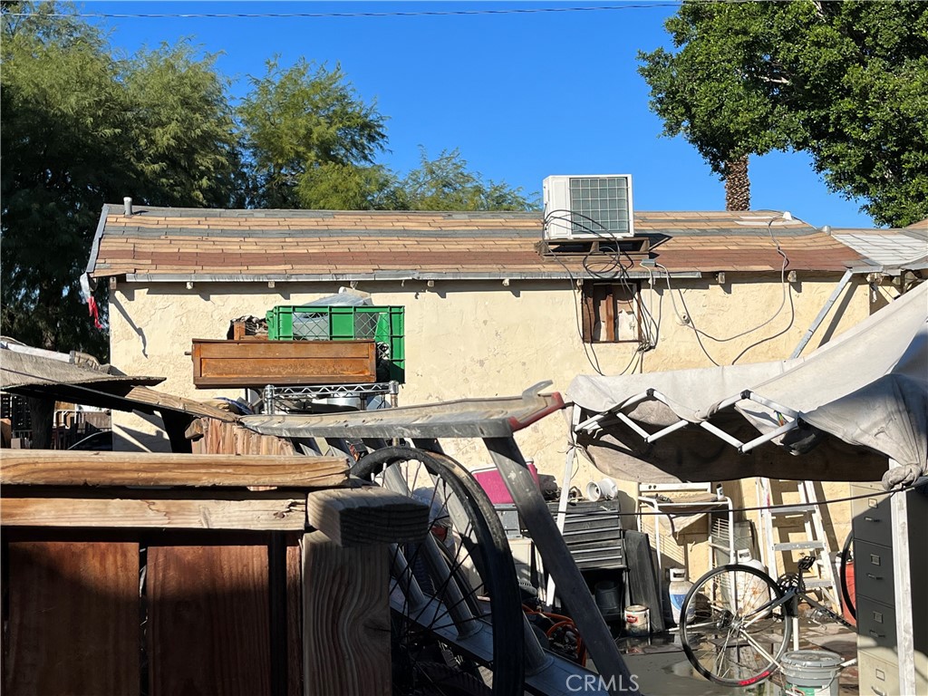 45639 King Street Indio, CA 92201 - Photo 26 of 28 a view of a patio with table and chairs with wooden floor