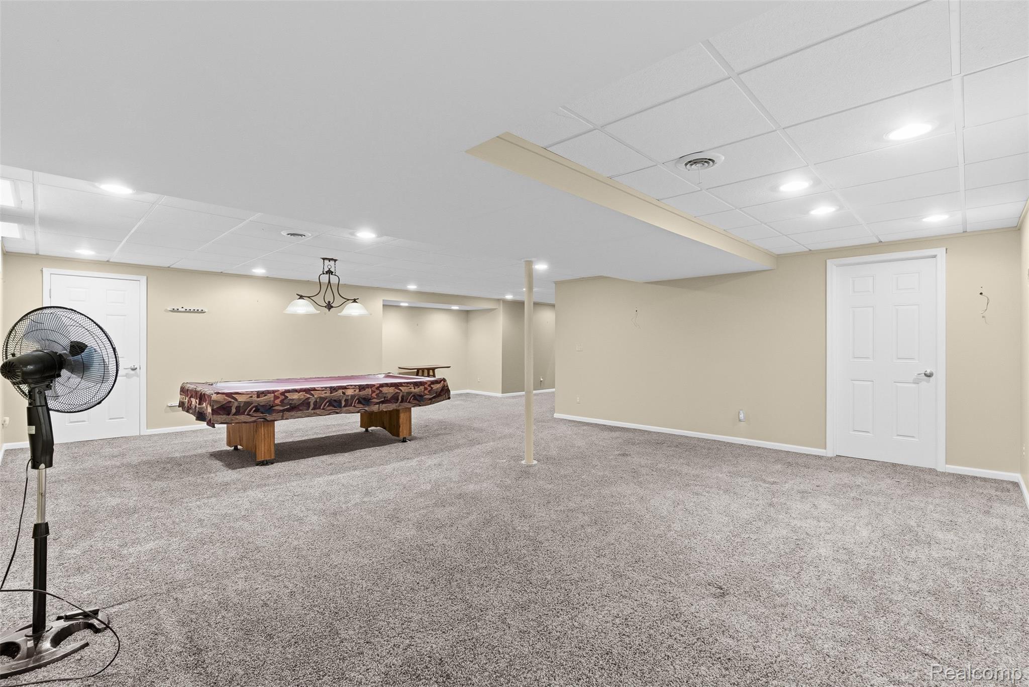8135 Ranch Estates Road Clarkston, MI 48348 - Photo 39 of 53 Expansive finished space with carpet flooring, recessed lighting, and a drop ceiling