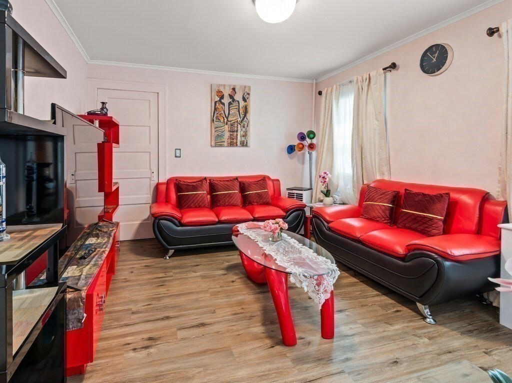 28 Maple Street Southbridge, MA 01550 - Photo 13 of 36 a living room with furniture a rug and a wooden floor