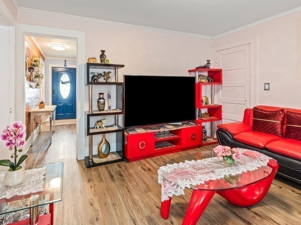 28 Maple Street Southbridge, MA 01550 - Photo 14 of 36 a living room with furniture and a flat screen tv