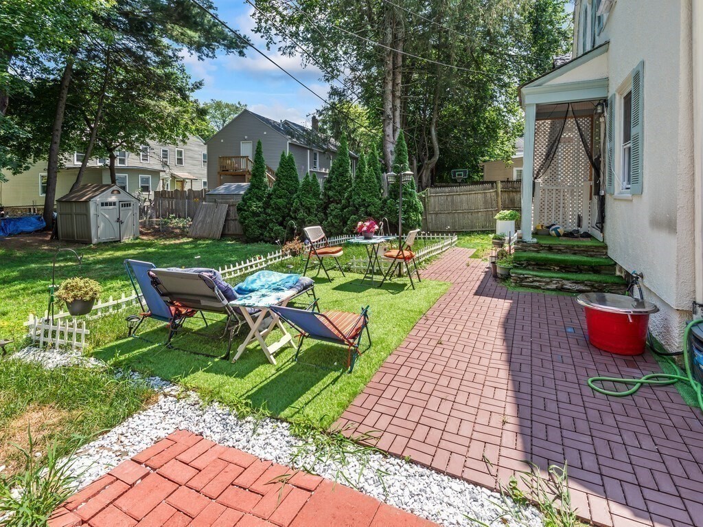 28 Maple Street Southbridge, MA 01550 - Photo 16 of 36 a view of backyard with outdoor seating ad green space