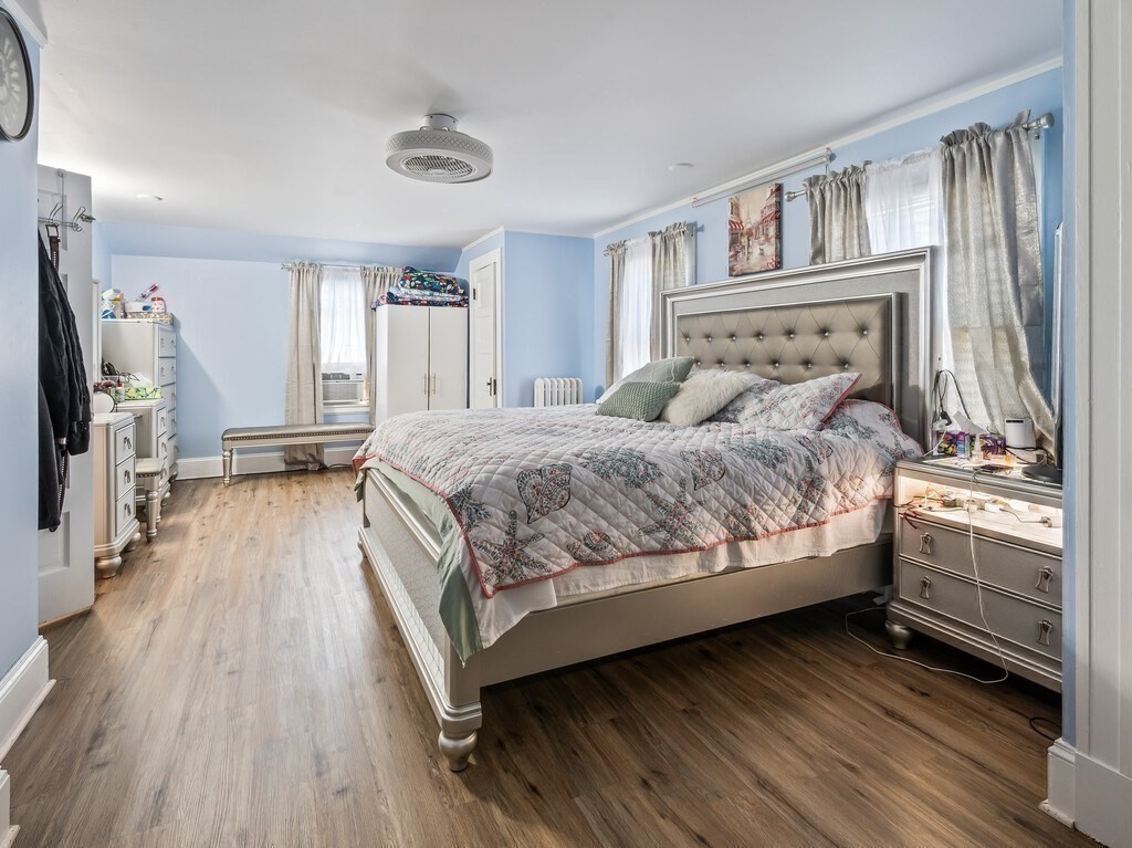 28 Maple Street Southbridge, MA 01550 - Photo 18 of 36 a bedroom with a bed and a flat tv screen on dresser