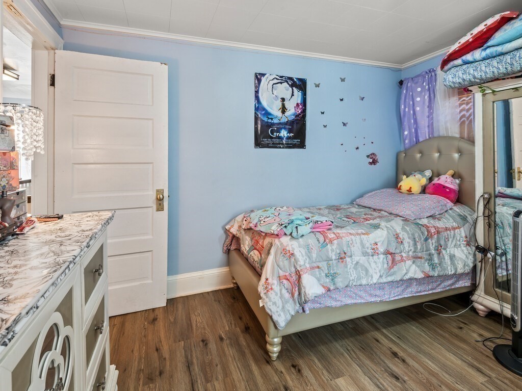 28 Maple Street Southbridge, MA 01550 - Photo 24 of 36 a bedroom with a bed and a desk