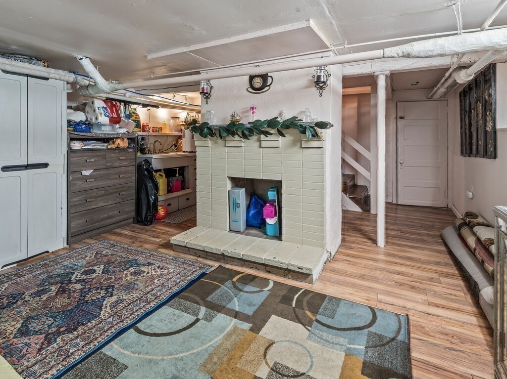28 Maple Street Southbridge, MA 01550 - Photo 27 of 36 a living room with furniture and a fireplace
