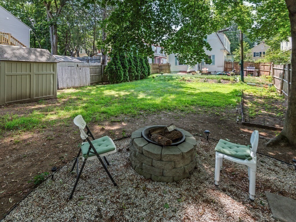 28 Maple Street Southbridge, MA 01550 - Photo 36 of 36 a backyard of a house with yard and outdoor seating