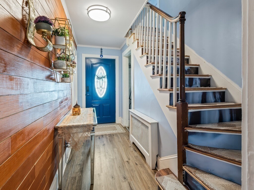 28 Maple Street Southbridge, MA 01550 - Photo 5 of 36 a view of staircase with wooden floor and white walls