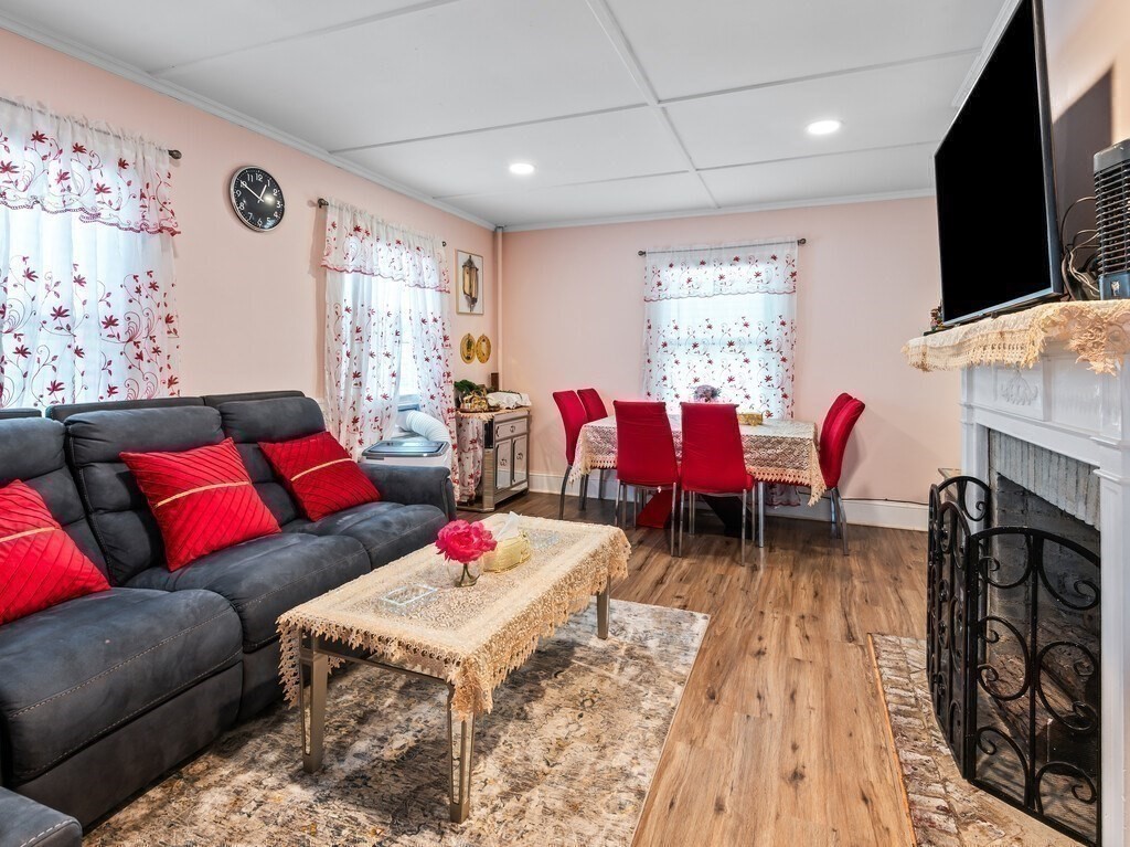 28 Maple Street Southbridge, MA 01550 - Photo 7 of 36 a living room with furniture fireplace and flat screen tv