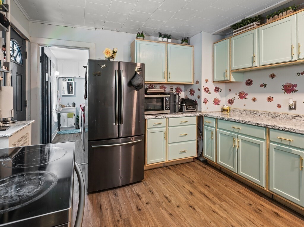 28 Maple Street Southbridge, MA 01550 - Photo 9 of 36 a kitchen with granite countertop a refrigerator stove and sink